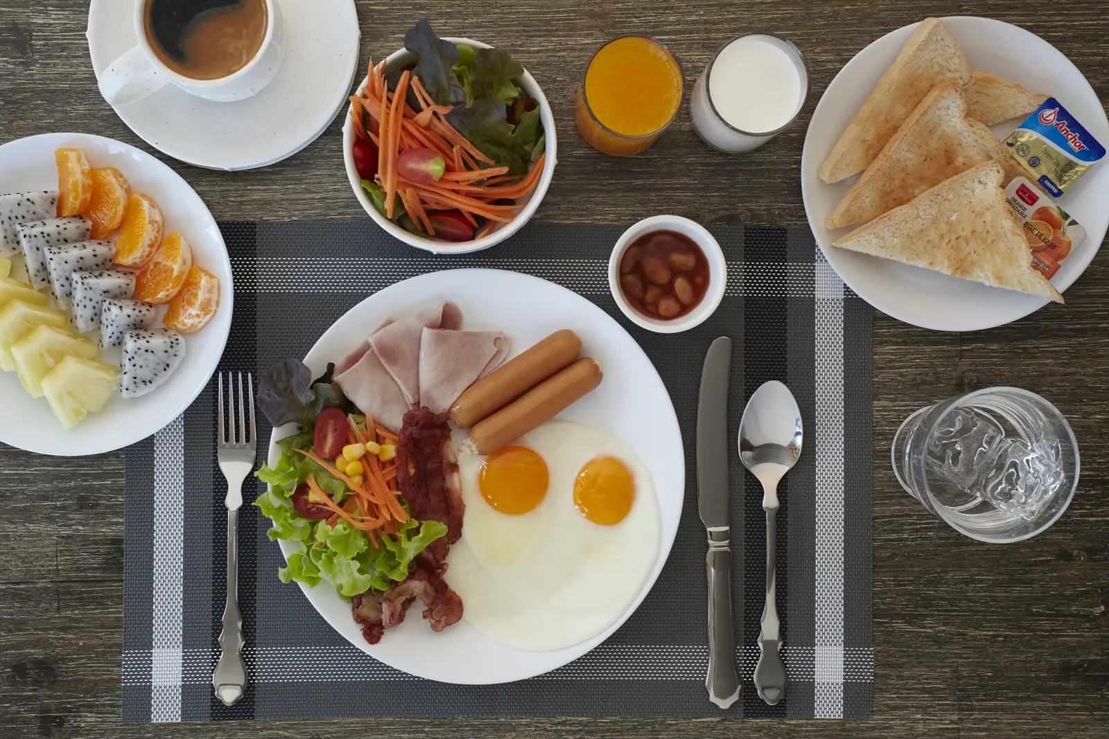 Breakfast spread with eggs, fruit and coffee
